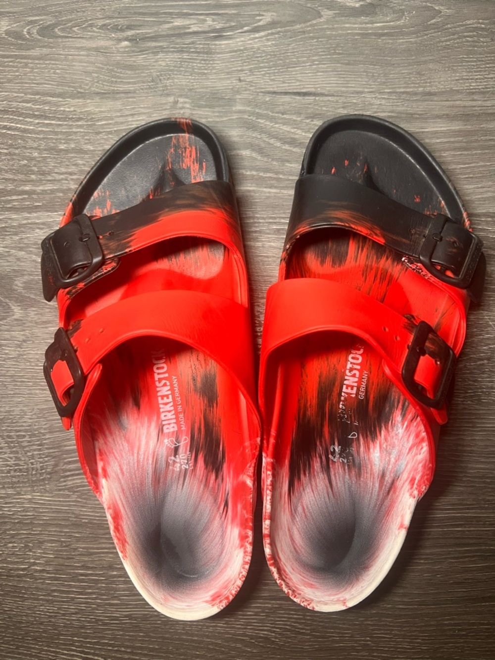 Birkenstock Men's Red, black, and white marbled effect.